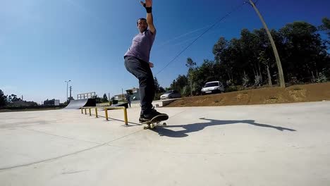 Skateboarder-sliding-down-rail