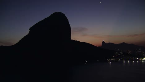 Flying-low-angle-aerial-view-of-Rio-de-Janeiro-at-Dusk,-Brazil