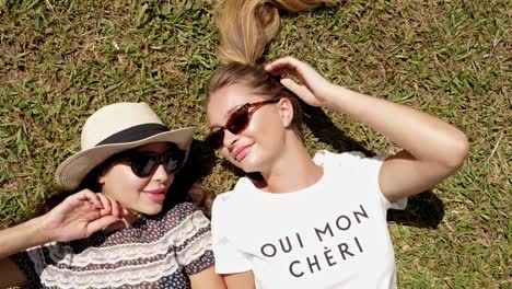 Girls-sunbathing-in-park