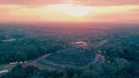 Borobudur-temple-aerial-view-at-sunrise-a-UNESCO-site-and-World-largest-Buddhist-temple,-Indonesia