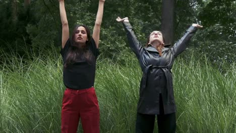 Young-Woman-Dancing-in-Front-of-Tall-Grass