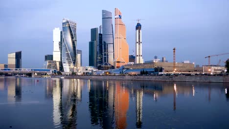 Morning-time-lapse-of-Moscow-City-(Moscow-International-Business-Center)-and-calm-Moskva-river,-Russia.