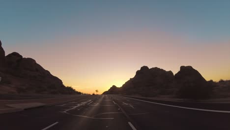 Drive-through-dramatic-Arizona-Papago-Park-Buttes-towards-Phoenix.