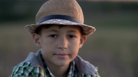 portrait-of-a-happy-village-boy-looking-at-the-camera-and-turning