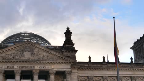 reichstag-dome-and-german-national-flag-at-berlin-in-germany