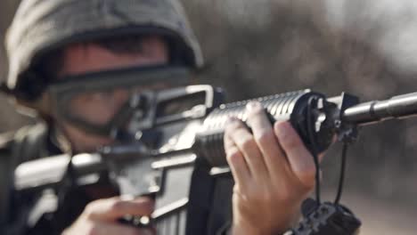 Israeli-soldier-pointing-his-rifle-and-scanning-the-area---close-up