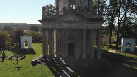 Aerial-View-of-an-Old-Catholic-Church-on-the-Outskirts-of-the-Village