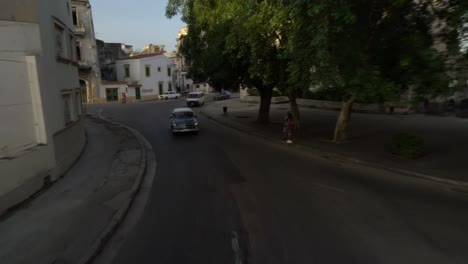 classic-1950's-American-Vintage-Taxi-Car-driving-on-street-old-Havana,-Cuba