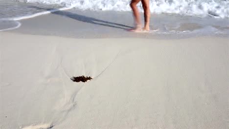 Woman-walking-on-the-beach