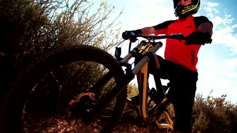 Mountain-bike-with-rider-on-a-trail-in-nature