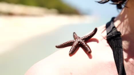 woman-with-starfish-on-shoulder