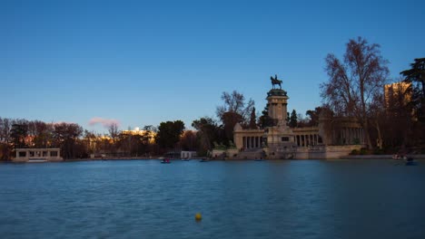 buen-retiro-park-pond-boat-riding-sunny-day-view-4k-time-lapse-madrid-spain