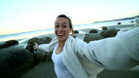 Self-portrait-of-young-woman-at-the-Moeraki-boulders-New-Zealand