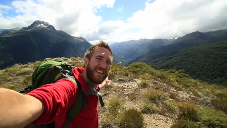 Self-portrait-of-a-hiker-on-beautiful-mountain-background