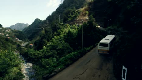 Bus-Goes-Through-an-Old-Bridge-in-a-Amazing-Scenary-in-Madeira.