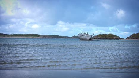 4k-Shot-of-Ship-Wreck-on-Irish-Coast-Beach