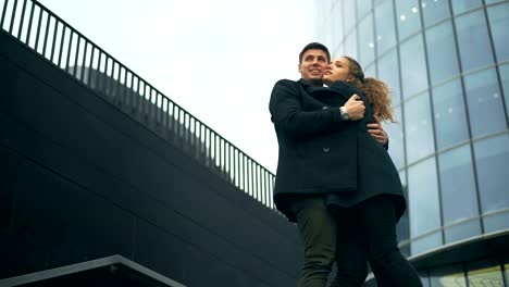 Pretty-beautiful-woman-and-her-handsome-stylish-boyfriend-hugging-on-the-street