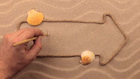 Mexico-inscription-written-by-hand-on-the-sand,-in-the-pointer-made-from-rope.