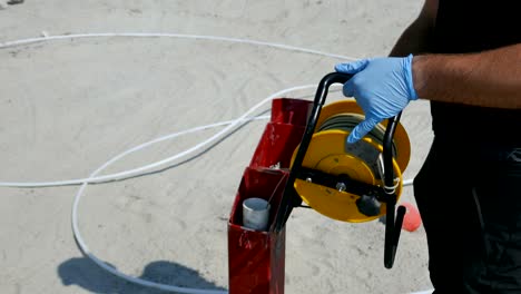 Technician-measuring-groundwater-depth