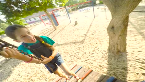 POV-footage-of-three-kids-playing-in-a-playground