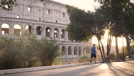 Man-in-sportswear-running-in-front-of-the-Colosseum-in-Rome-at-sunset
