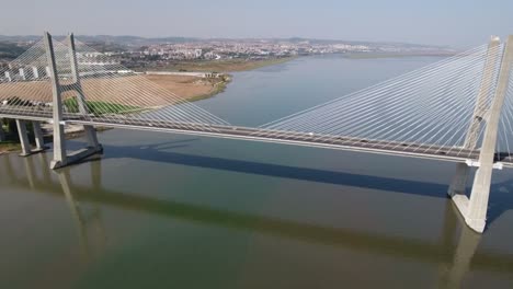 Flying-over-the-longest-bridge-in-Europe---Vasco-da-Gama-in-Lisbon,-Portugal