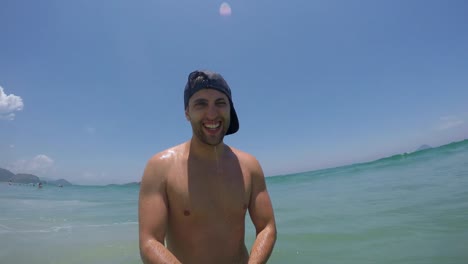 Young-Brazilian-Guy-Having-Fun-and-taking-a-selfie-on-the-beach