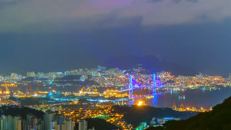 4K,-Zeitraffer-Ansicht-von-Busan-in-der-Nacht-mit-einer-Brücke-aus-Südkorea