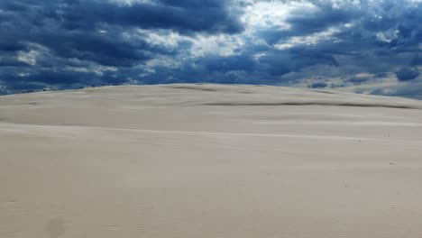 Sandy-Desert-and-Dark-Storm-Clouds