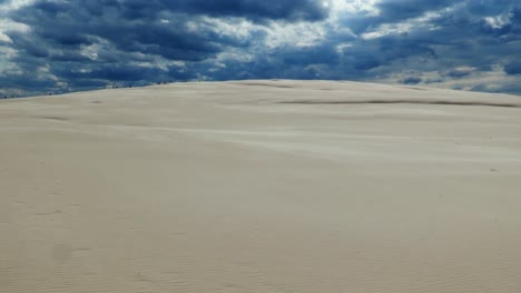 Sandy-Desert-and-Dark-Storm-Clouds