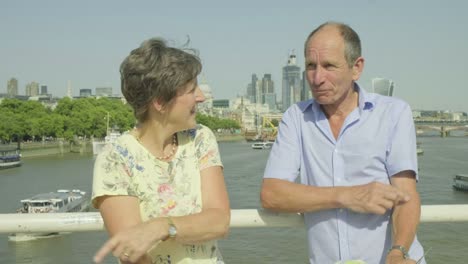 Active-senior-couple-looking-at-a-map-in-london