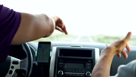 Two-young-people-listen-to-music-in-the-car.