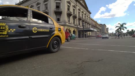 Classic-1950's-American-Vintage-Cuban-Convertible-Taxi-Cars-driving-on-the-street-of-Havana-city,-Cuba.