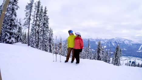 Couple-standing-together-in-a-snowy-landscape-4k