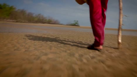 Man-walking-by-the-beach