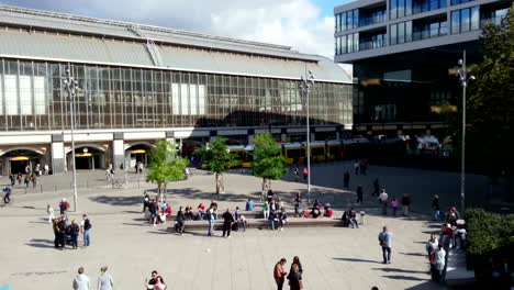 Time-lapse-of-people-walking,-enjoying-sunny-weather-at-Alexanderplatz,