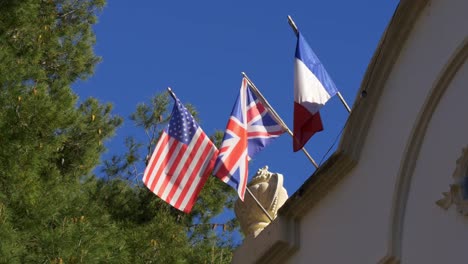 sun-light-american-england,-Frankreich-flags-blue-sky-4-k-Spanien