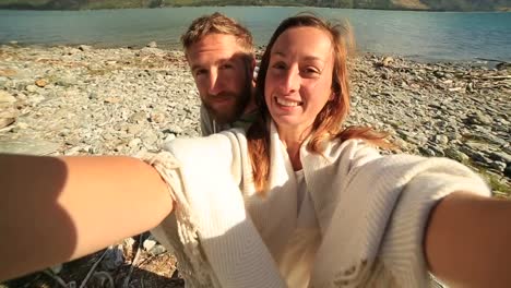 Self-portrait-of-a-young-couple-by-the-lake-shore