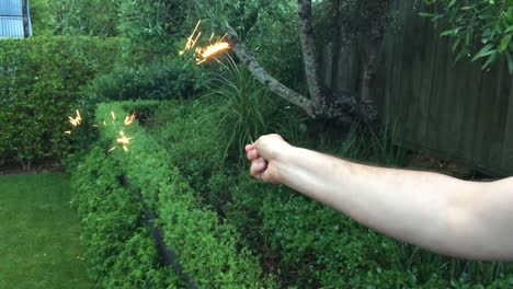 Man-plays-with-fireworks-in-slow-motion