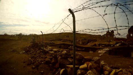 barbed-wire,-remains-of-the-minaret,-ruins-of-Date-Harran-University-East-of-Turkey,-border-with-Syria