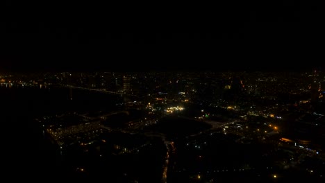 Aerial-city-with-skyscrapers-and-buildings-by-night.-Philippines,-Manila,-Makati