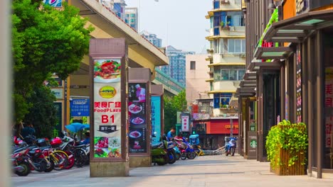 day-time-shanghai-city-sidewalk-square-stores-panorama-4k-timelapse-china