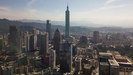 sunny-day-taipei-cityscape-famous-tower-aerial-downtown-panorama-4k-timelapse-taiwan