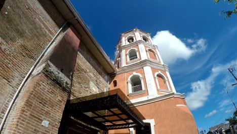 Colonial-16th-century-Spanish-built-of-Saint-Paul-the-First-Hermit-Cathedral-also-known-as-San-Pablo-Cathedral,-showing-her-bell-tower.-tracking-shot