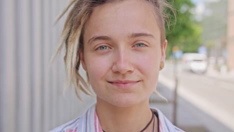 Young-Lady-with-Modern-Hairstyle-Smiling-Outdoors