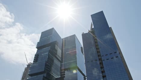 Timelapse-of-glass-skyscrapers-in-Tel-Aviv,-Israel-with-cloud-reflections