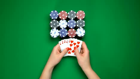 Female-poker-player-showing-royal-flush-combination,-big-win,-top-view