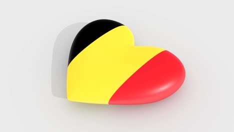 Pulsierende-Herz-in-den-Farben-der-Belgien-Flagge-auf-einem-weißen-Hintergrund,-3D-Rendering,-Schleife