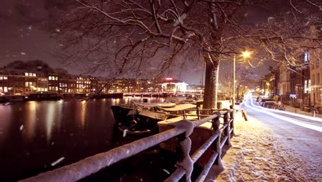 Snowing-in-Amsterdam-Netherlands-at-night-in-winter