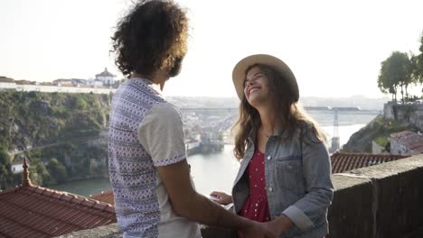 Young-couple-on-high-view-point-above-city